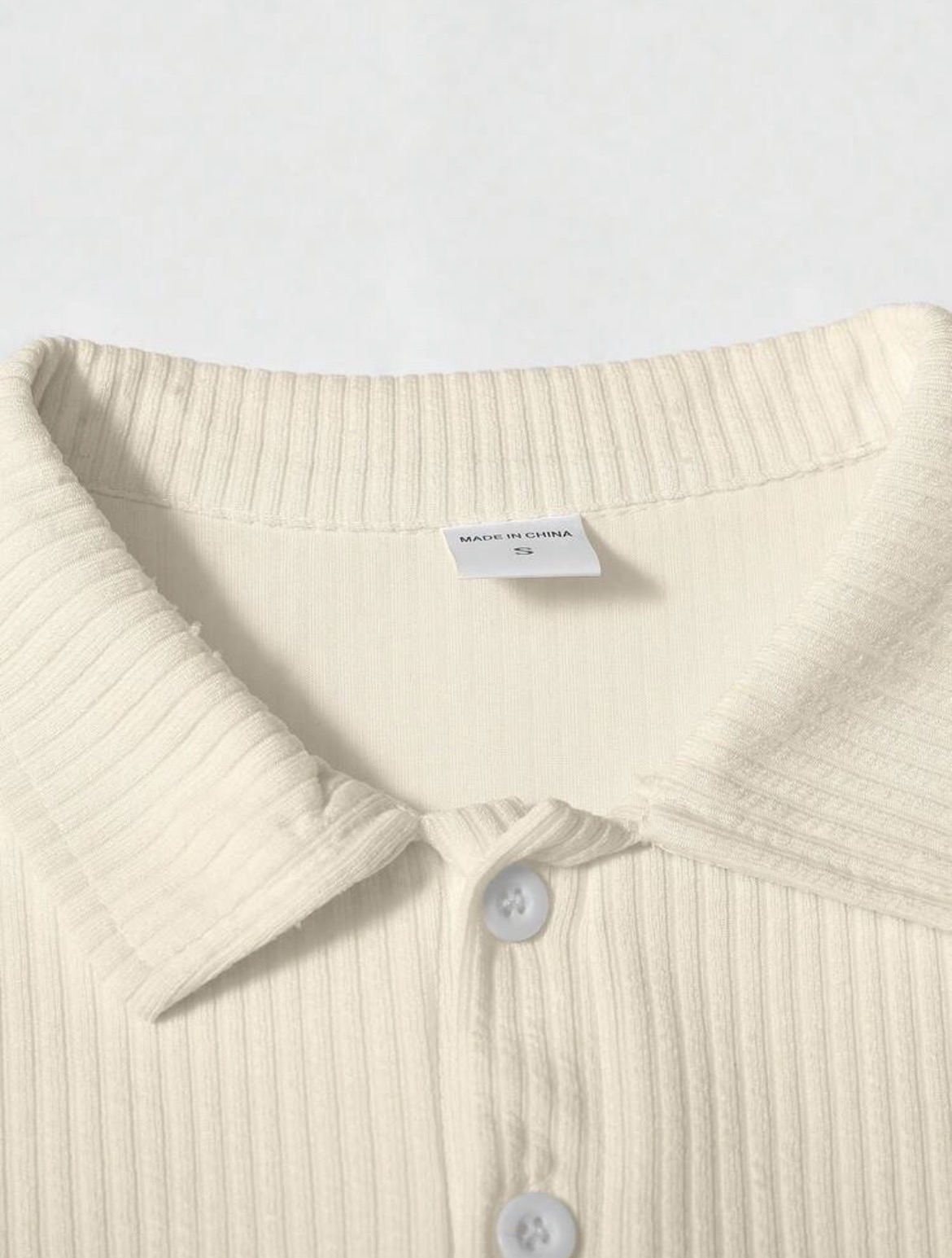 L - Polo manga larga con textura